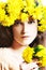 Young woman with wreath of yellow flowers