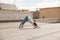 Young woman in a yoga downward-facing dog pose