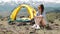 Young women camping tents on shore the morning