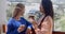 Young women chatting on an open-air patio