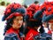 Young women colorful masquerades for pageant