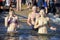 Young women cross themselves plunging into icy water during the feast Epiphany on the Dnieper River