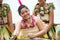 Young women, dancer with handmade dress from raffia and neckless decoration made from nature material in Kingdom of Tonga.