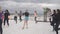 Young women do aerobic jumping and doing sport exersises on the beach