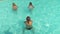 Young women doing aqua gym in the resort pool in vacation