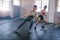 Young women doing rope pulling exercises at a gym