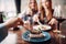 Young women eats sweet cakes in restaurant