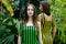 Young women in elegant striped dresses