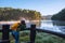 Young women Enjoying tourism take pictures nature, watching the beautiful lake in Thailand