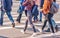 young women feet, crossing an urban street