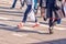 Young women feet, crossing an urban street