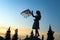 Young women flying a rainbow kite