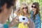 Young Women Friends Taking Pictures On Vacation