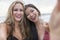 Young Women Girls Taking Selfie Photograph on Beach