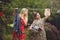 Young women hanging clothes after washing in the courtyard in the open air, female life and fun