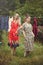 Young women hanging clothes after washing in the courtyard in the open air, female life and fun