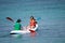 Young women kayaking down a sea