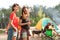 Young women near camping tent