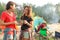 Young women near camping tent