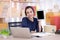 Young women owner working at home office and smile looking at camera