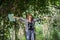 Young women people Hiking with friends backpacks walking together and looking map and taking photo camera by the road and looking