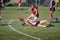 Young women play Australian Rules Football 