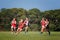 Young women play Australian Rules Football