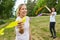 Young women play with colorful ribbons