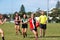 Young women playing Australian Rules Football