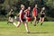 Young women playing Australian Rules Football