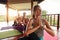 Young women practicing yoga in half spinal twist pose