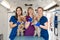 Young women professional pet doctors posing with yorkshire terriers inside pet ambulance. Animals healthcare concept