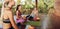 Young women relaxing with coconut juice at yoga class