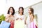 young Women showing Shopping Bags and credit card