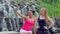 Young women taking selfie near waterfall. Multiracial women taking seflie