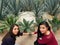 young women touching the blade of a maguey plant