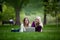 Young Women Using Laptop in Park