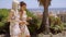 Young women walking arm in arm on an outdoor patio