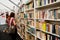 Young women watch the showcase with old books