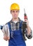 Young worker with a drill is angry