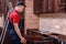 A young worker installs a drawer. Installation of modern wooden kitchen furniture