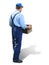 Young worker in working clothes, carrying a box. Looked from behind