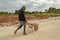 Young Workman With Wheelbarrow