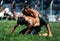 A young wrestler attempts to overpower his opponent at the Elmali turkish Oil Wrestling Festival in Turkey.