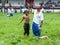 A young wrestler is awarded victory at the Kirkpinar Turkish Oil Wrestling Festival in Edirne in Turkey.