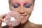 Young young woman with donut in mouth