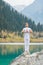 Young zen man in meditation. Outdoor yoga in mountain lake