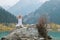 Young zen man in meditation. Outdoor yoga in mountain lake. Exercise Agni Stambhasana