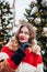 Younggirl on the red Square through winter holiday in Moscow, stylish and beautiful posing near to Christmas tree