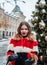 Younggirl on the red Square through winter holiday in Moscow, stylish and beautiful posing near to Christmas tree